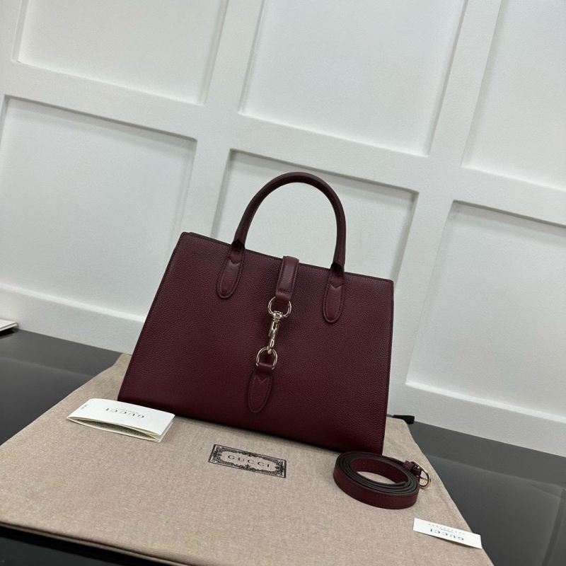 G*u*i top handle bags